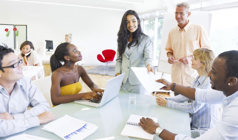 Group of working team around table